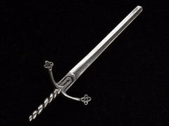 thumbnail of Large silver sword brooch on black background.