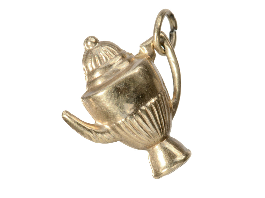 A gold 1964 Gold Teapot Charm shown on white background