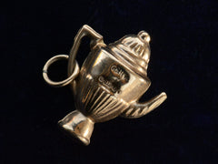 thumbnail of The reverse side of 1964 Gold Teapot Charm showing English hallmarks and the date letter "i."