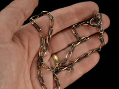 thumbnail of Detail view of c1900 Thin Antique Chain of Alternating Links of Gilt Silver and Striped Niello (shown on hand)