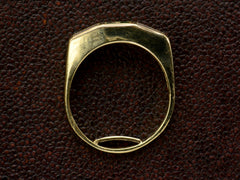 thumbnail of Side profile view of vintage Tiffany yellow gold ring, shown on textured background.
