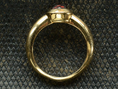 thumbnail of Side profile of Vintage Tiffany Ring with Rose Cut Red Garnet set in heavy 18K Yellow Gold Mounting (on dark background)
