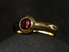 thumbnail of Angled view of Vintage Tiffany Ring with Rose Cut Red Garnet set in heavy 18K Yellow Gold Mounting (on dark background)