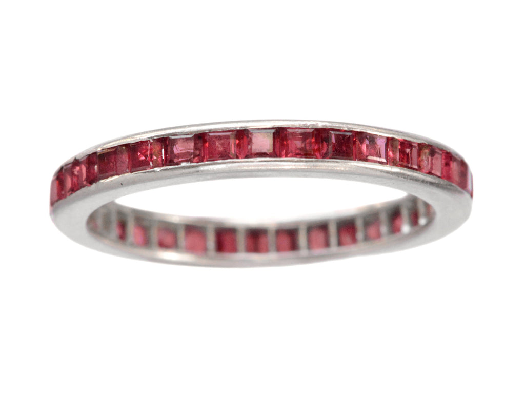 c1950 Tiffany & Co platinum eternity band with square red rubies, on white background.