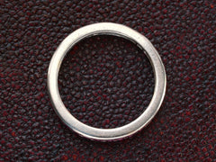 thumbnail of Side profile of c1950 Tiffany & Co platinum eternity band  on dark textured background.
