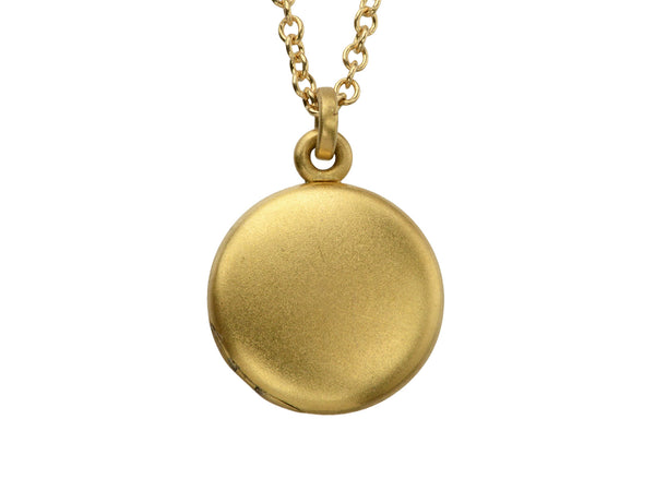 Small  gold round antique locket on chain, on white background.