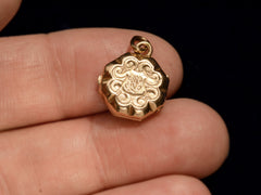 thumbnail of c1890 Tiny Gold Locket, Reverse Side (on hand for scale)