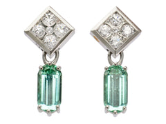 thumbnail of A pair of c1990 white gold earrings with diamond-shaped diamond studded tops and teal tourmaline pendants (on white background)