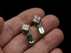 thumbnail of A pair of c1990 white gold earrings with diamond-shaped diamond studded tops and teal tourmaline pendants (on hand)