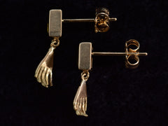 thumbnail of Side profile view of EB Modern Earrings with Rectangular Olive Colored Tourmaline Tops and Hand Pendants in Yellow Gold (shown on dark background)