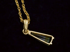 thumbnail of Backside detail of c1980 Green and White Tourmaline Pendant in Yellow Gold. Indecipherable stamp visible on the back of the bale. On dark background.