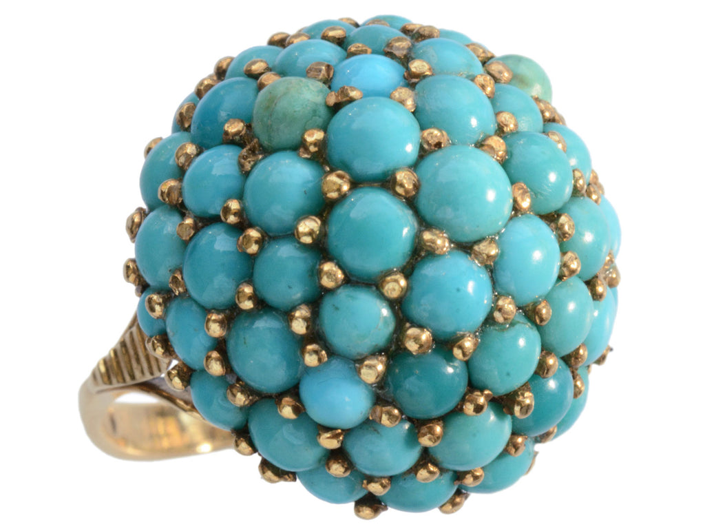 Left angled view of c1950 vintage turquoise cluster ring in yellow gold, shown on white background.