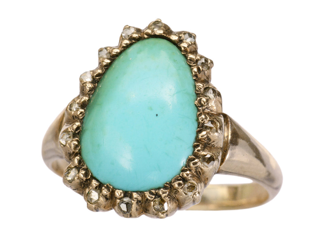 Antique rose gold ring with egg shaped turquoise surrounded by small rose cut diamonds, shown on white background.