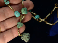 thumbnail of Detail view of c1920 Art Deco turquoise nugget and white enamel brass chain necklace, shown on hand for scale