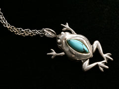 thumbnail of Silver frog pendant with turquoise stone on a black background