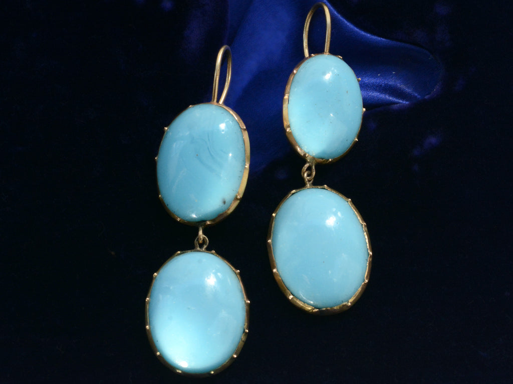 c1890 Oval Turquoise Glass Drop Earrings, shown on dark blue background