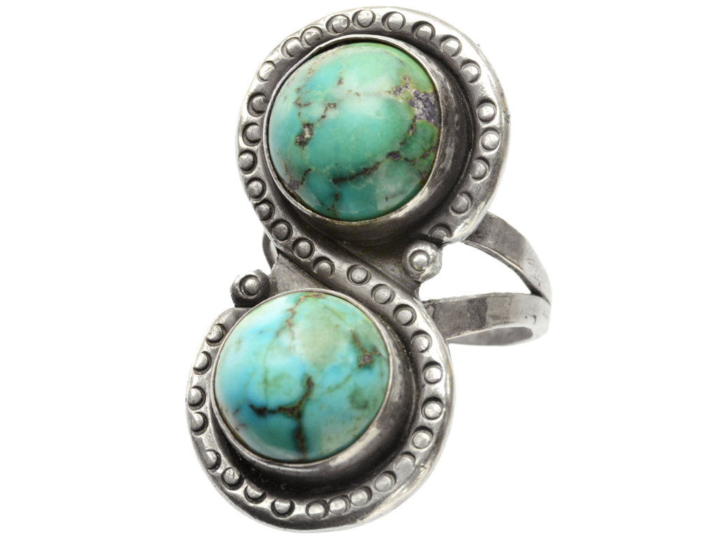Right angled front view of Silver ring with two turquoise stones on a white background