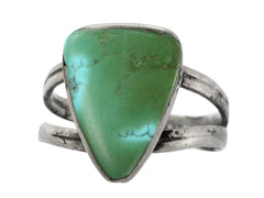 thumbnail of Angled view of a sterling silver ring featuring a large, polished green triangular turquoise stone with natural matrix lines, set against a plain white background.