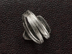 thumbnail of Back of shank view of a sterling silver ring featuring set against a dark textured background.