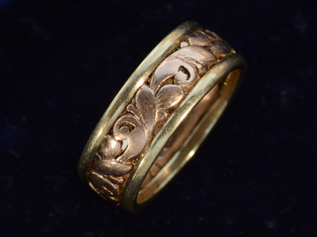 Angled view of c1890 Two-Toned Rose and Green Gold Band (on dark blue background)