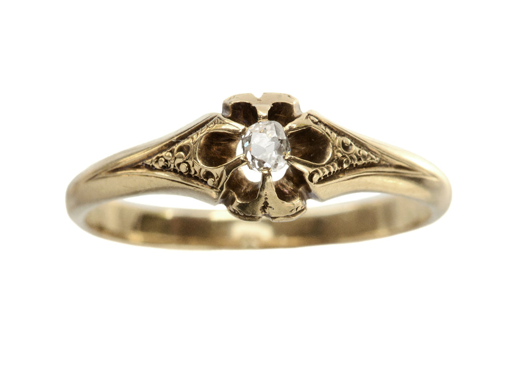 c1880 Victorian belcher setting engagement ring with a small old mine cut diamond set in yellow gold, shown on white background.