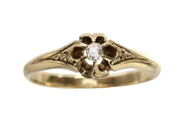 c1880 Victorian belcher setting engagement ring with a small old mine cut diamond set in yellow gold, shown on white background.