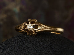 thumbnail of Angled right view of c1880 Victorian belcher setting engagement ring with a small old mine cut diamond set in yellow gold, shown on dark background.