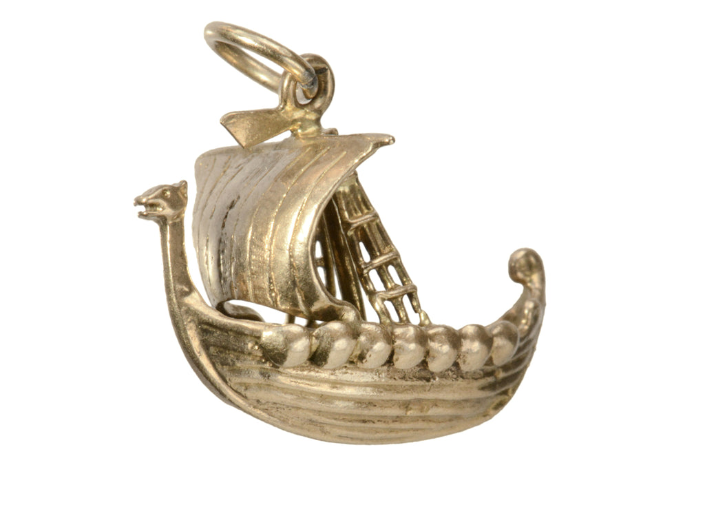 A yellow gold c1960 Viking Ship Charm, shown on white background