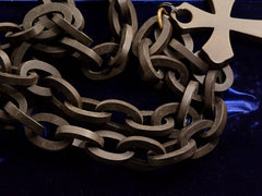 thumbnail of Detail of c1880 Black Vulcanite Cross & Chain (on dark blue background)