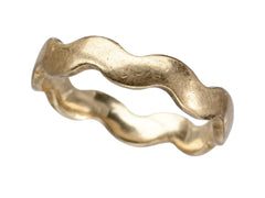 thumbnail of A gold ring with a wave-form design, on white background.