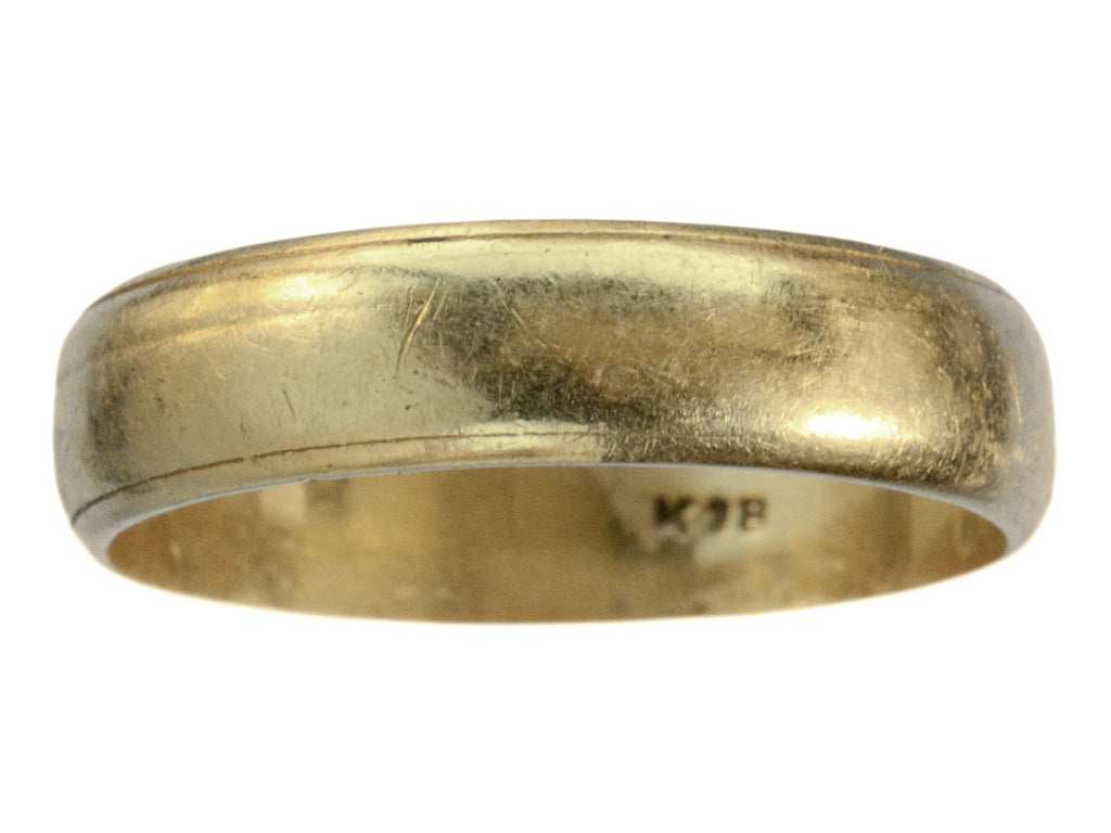 c1920 Wide 18K yellow gold wedding band with edge detailing and a mark inside reading "K18." On white background.
