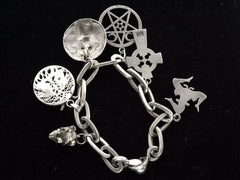 thumbnail of Reverse side of vintage sterling silver charm bracelet. Stamps on charms faintly visible include "STERLING" and "925"
