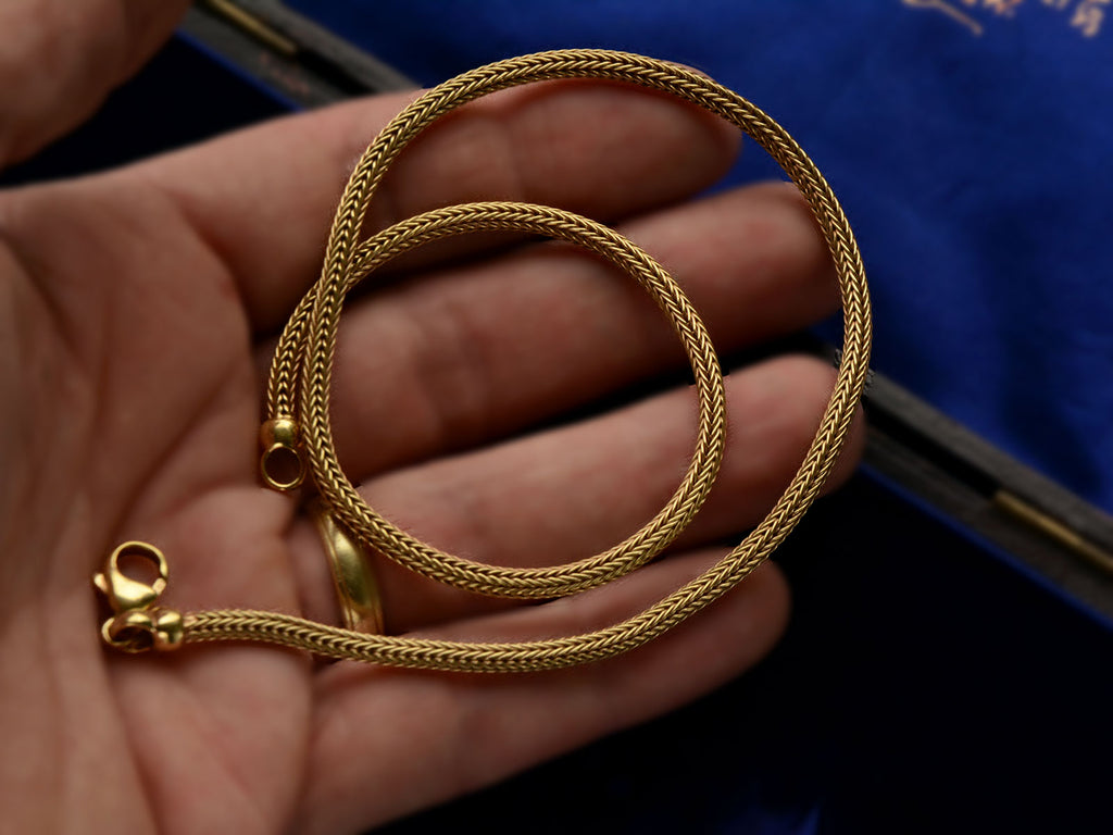 c1980 Woven 18K Yellow Gold Necklace Chain, shown coiled on hand