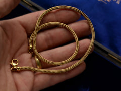 thumbnail of c1980 Woven 18K Yellow Gold Necklace Chain, shown coiled on hand