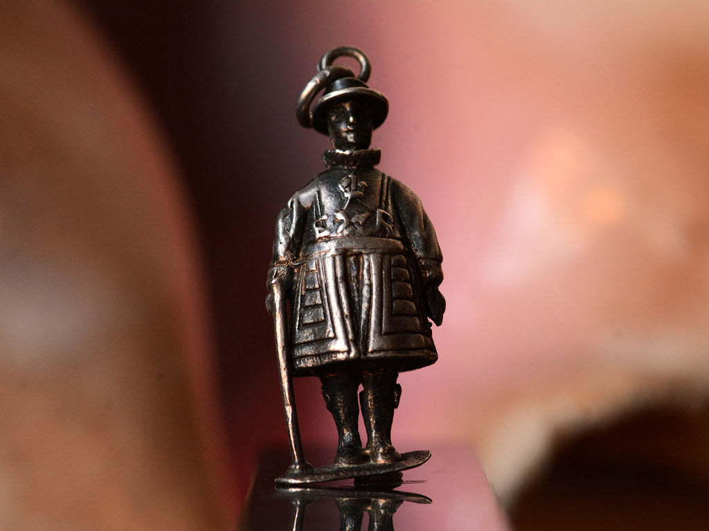 c1960 Silver Beefeater Charm (front view on pink background)