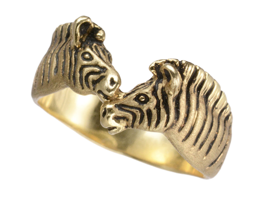 Angled view of two-headed zebra ring in 14K with black details, shown on white background.