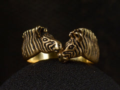 thumbnail of Front view of two-headed zebra ring in 14K with black details, shown on dark background.