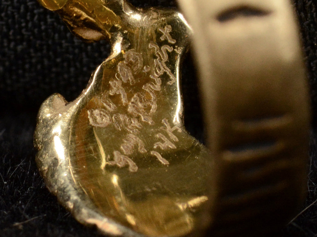 Close up of a signature inside ring reading "1993 Gayle Bright 14K."