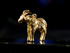 thumbnail of 1968 Gold Goat Charm (on black background)